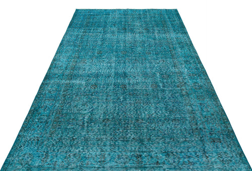 Load image 1 in gallery view. Teal distressed vintage-style rug with a faded traditional medallion pattern on a white background.