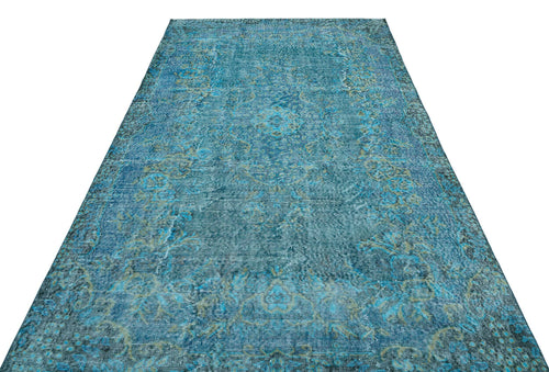 Load image 1 in gallery view. Teal and olive green distressed area rug with a traditional faded medallion pattern on a white background.