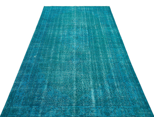 Load image 1 in gallery view. Teal distressed vintage-style rug with a faded traditional medallion pattern on a white background.