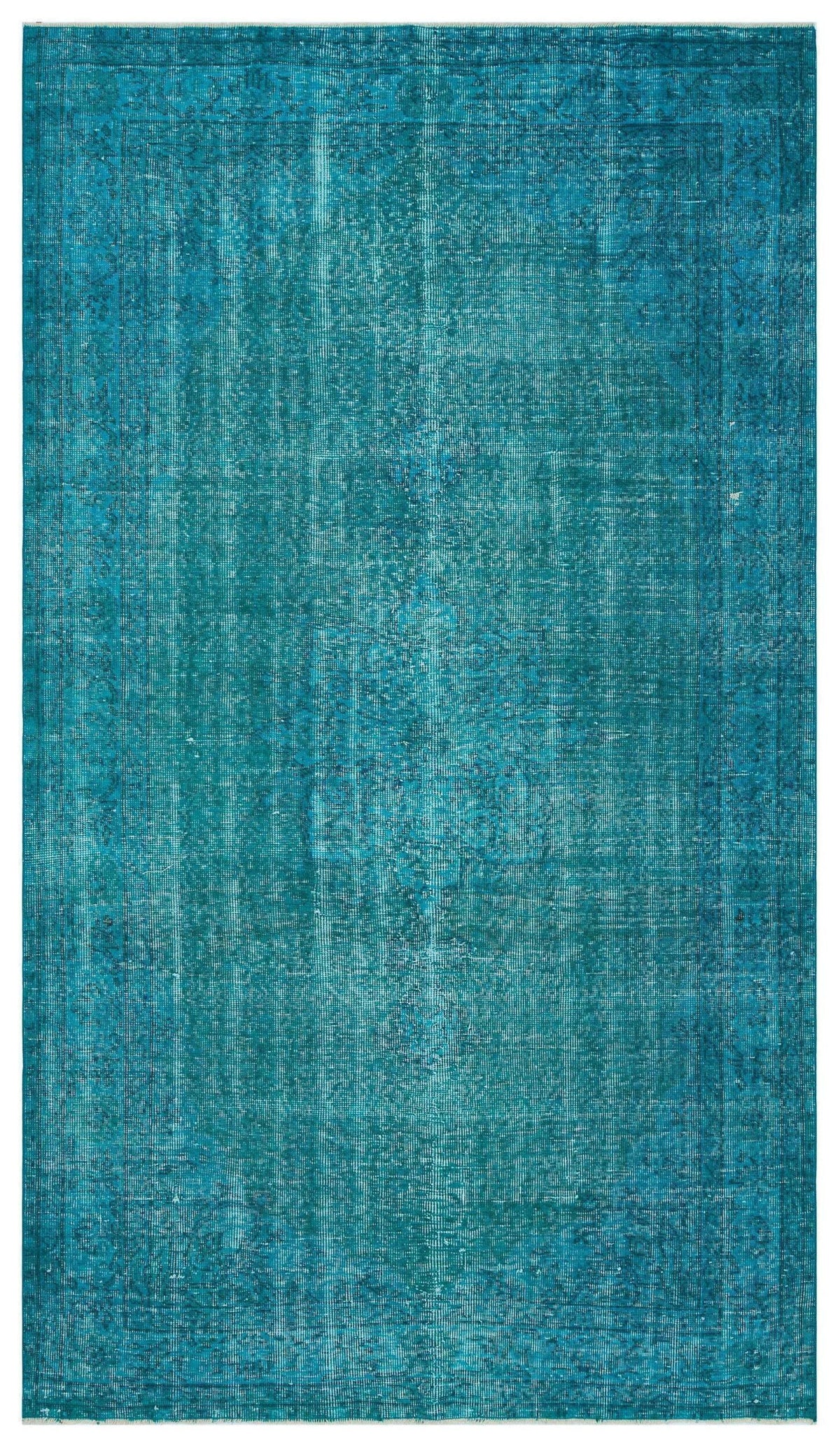 Teal distressed traditional rug with a faded central medallion and ornate border on a white background.