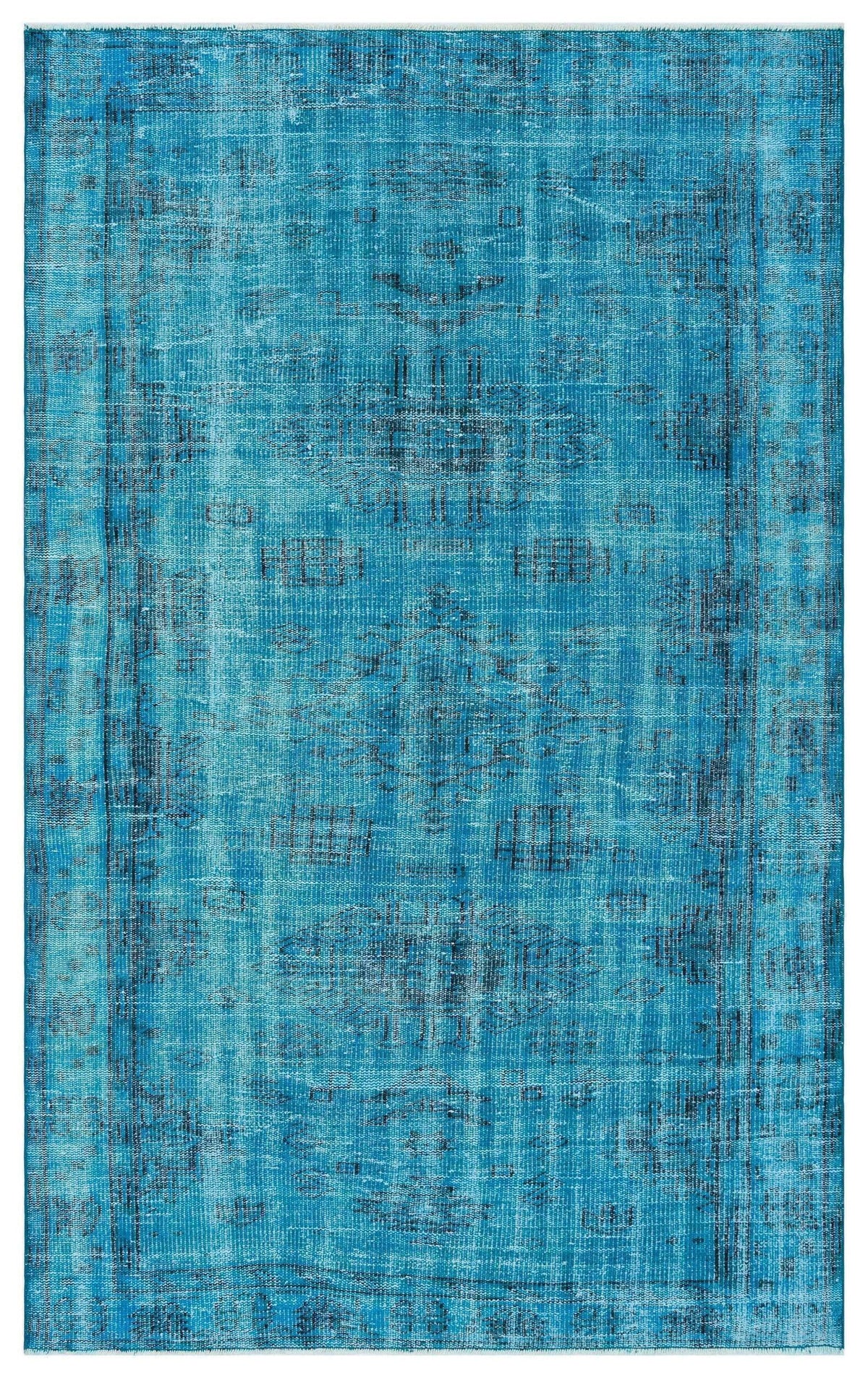 Bright blue distressed area rug with a faded traditional medallion pattern and a bordered edge.