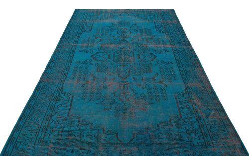 Load image 1 in gallery view. Teal and black distressed rug with a traditional central medallion and ornate border on a white background.