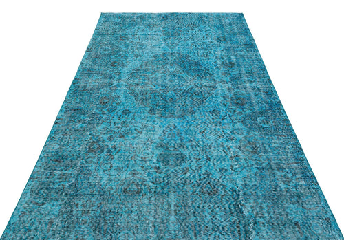 Load image 1 in gallery view. Bright turquoise runner rug with a distressed, dark blue traditional medallion pattern on a white background.