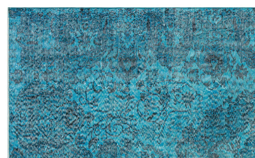 Load image 1 in gallery view. Teal and dark blue distressed rug with a faded traditional floral medallion pattern.