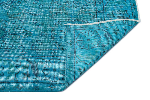 Load image 1 in gallery view. Turquoise and black distressed traditional medallion rug with a folded corner on a white background.