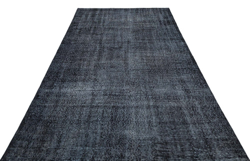 Load image 1 in gallery view. Charcoal and black distressed vintage-style rug with a subtle, faded texture on a white background.