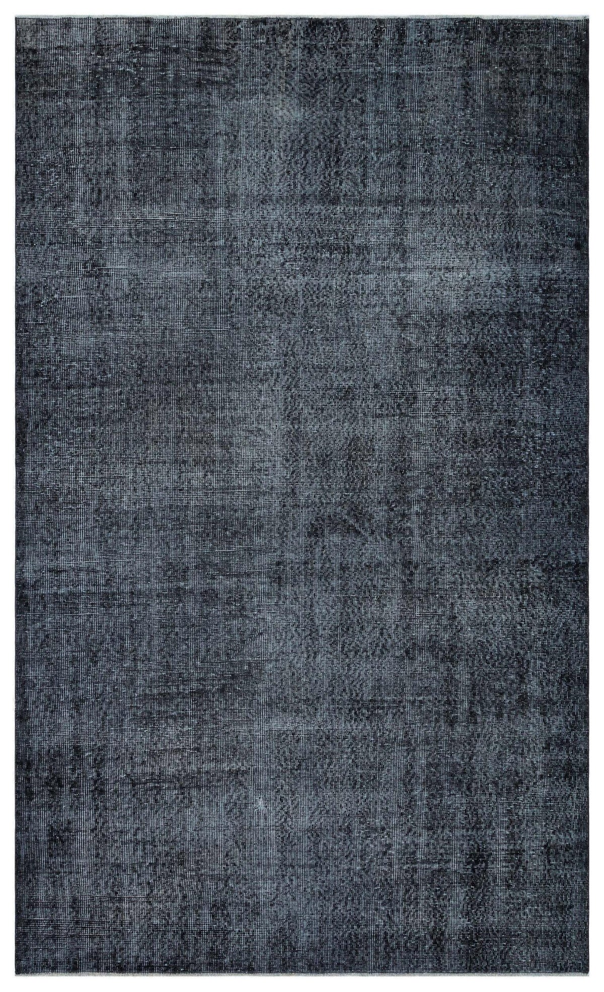 Charcoal and slate grey distressed rug with a faded, monochromatic vintage-style texture.