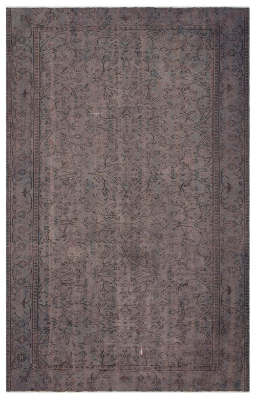 Load image 1 in gallery view. Dark brown vintage-style rug with a faded floral medallion pattern and a detailed border.