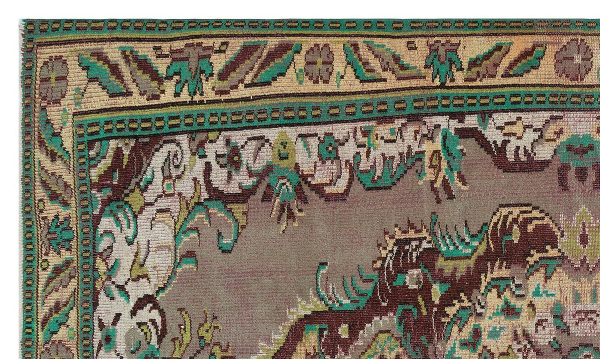 Taupe, teal, and brown traditional rug with a detailed floral border and intricate geometric motifs.