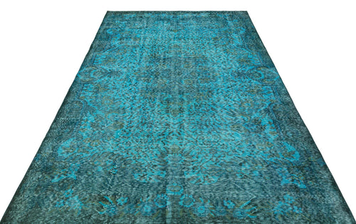 Load image 1 in gallery view. Teal and dark green distressed vintage-style rug with a traditional floral medallion pattern on a white background.