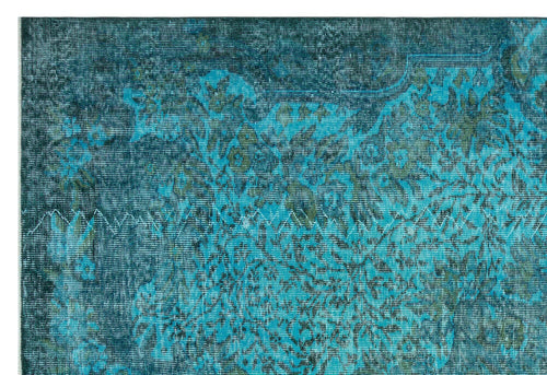 Load image 1 in gallery view. Teal and dark blue distressed rug with a faded traditional floral medallion pattern.