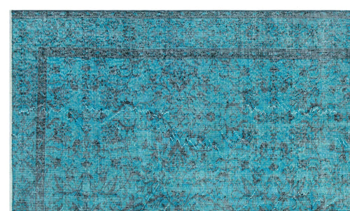 Load image 1 in gallery view. Teal and black distressed rug with a traditional floral medallion border and faded vintage pattern.