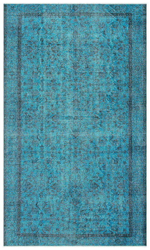 Load image 1 in gallery view. Bright turquoise distressed rug with a dark blue traditional floral medallion pattern and a bordered edge.
