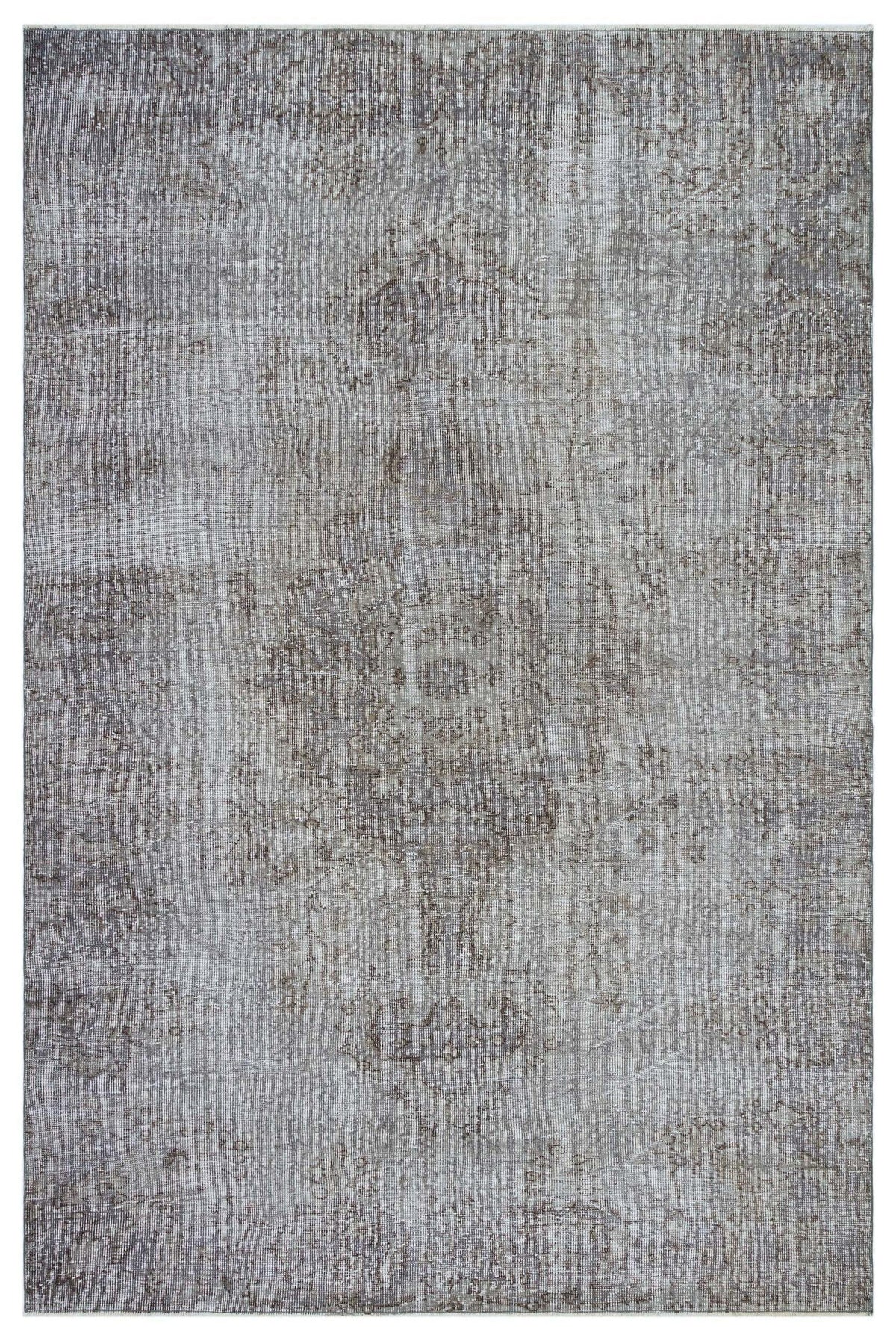 Grey and taupe distressed area rug with a faded traditional medallion pattern on a white background.
