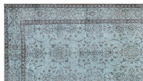 Load image 1 in gallery view. Light blue and dark brown traditional rug with a distressed floral medallion pattern and a detailed border.