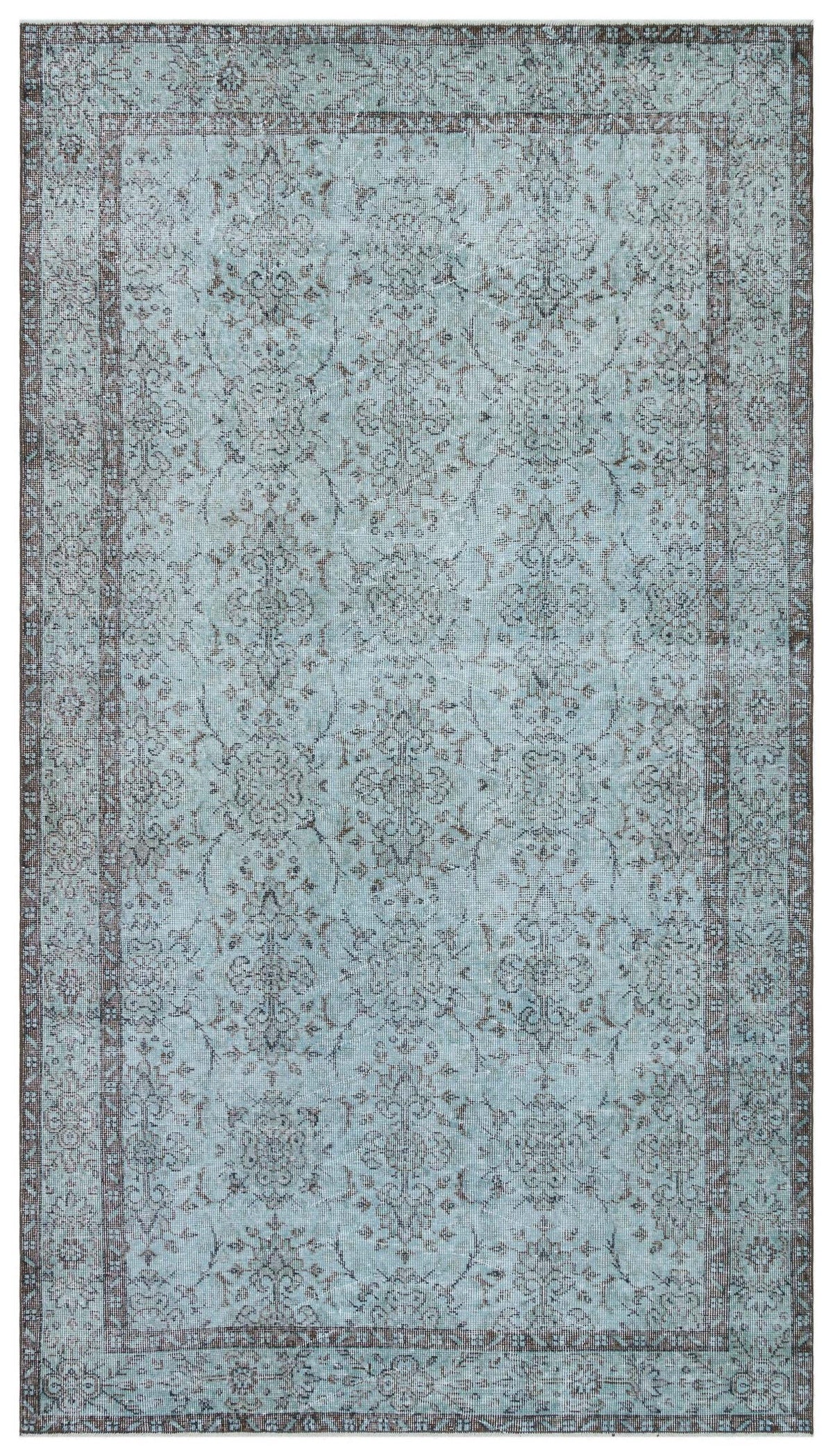 Light blue and charcoal grey traditional rug with a distressed floral medallion pattern and a bordered edge.