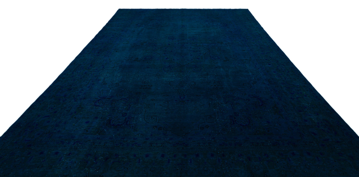 Deep navy blue rug with a subtle, tonal traditional medallion pattern on a white background.