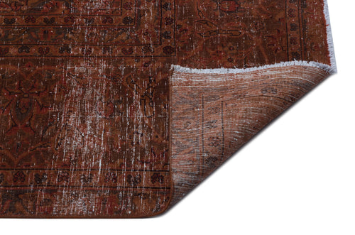 Load image 1 in gallery view. Distressed rust-colored rug with a traditional Persian-style pattern and a folded corner showing the underside.