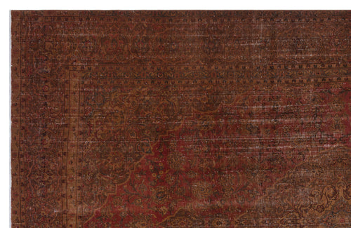 Load image 1 in gallery view. Distressed dark red and brown traditional rug with an intricate floral medallion pattern and a wide decorative border.