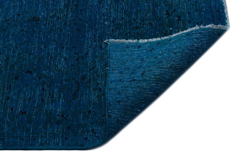 Load image 1 in gallery view. Deep blue distressed rug with small black geometric motifs and a folded corner showing the underside.