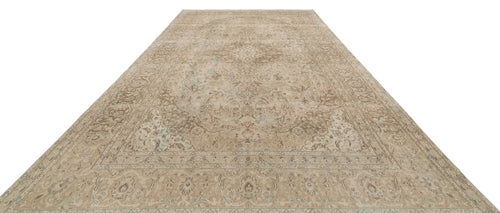 Load image 1 in gallery view. Beige and brown traditional rug with a distressed floral medallion pattern on a white background.