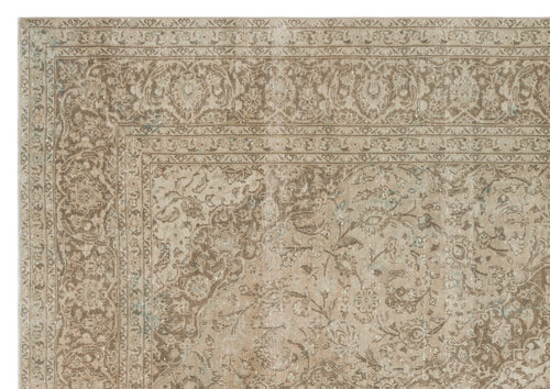 Load image 1 in gallery view. Taupe and beige distressed rug with a traditional floral medallion pattern and ornate border.
