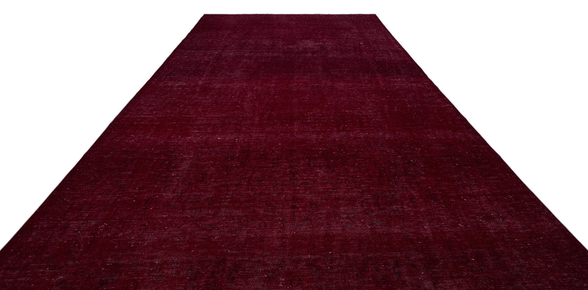 Deep burgundy vintage-style rug with a subtle, distressed monochromatic pattern on a white background.