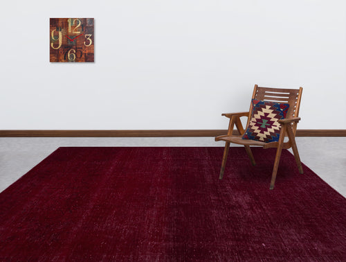 Load image 1 in gallery view. Solid deep red rug with a subtle distressed texture, styled in a room with a wooden chair and wall clock.