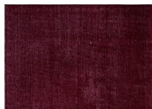 Load image 1 in gallery view. Deep burgundy solid-color rug with a distressed, textured finish.