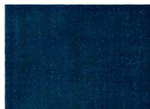 Load image 1 in gallery view. Deep navy blue rug with a distressed, speckled texture and a faint traditional border pattern.