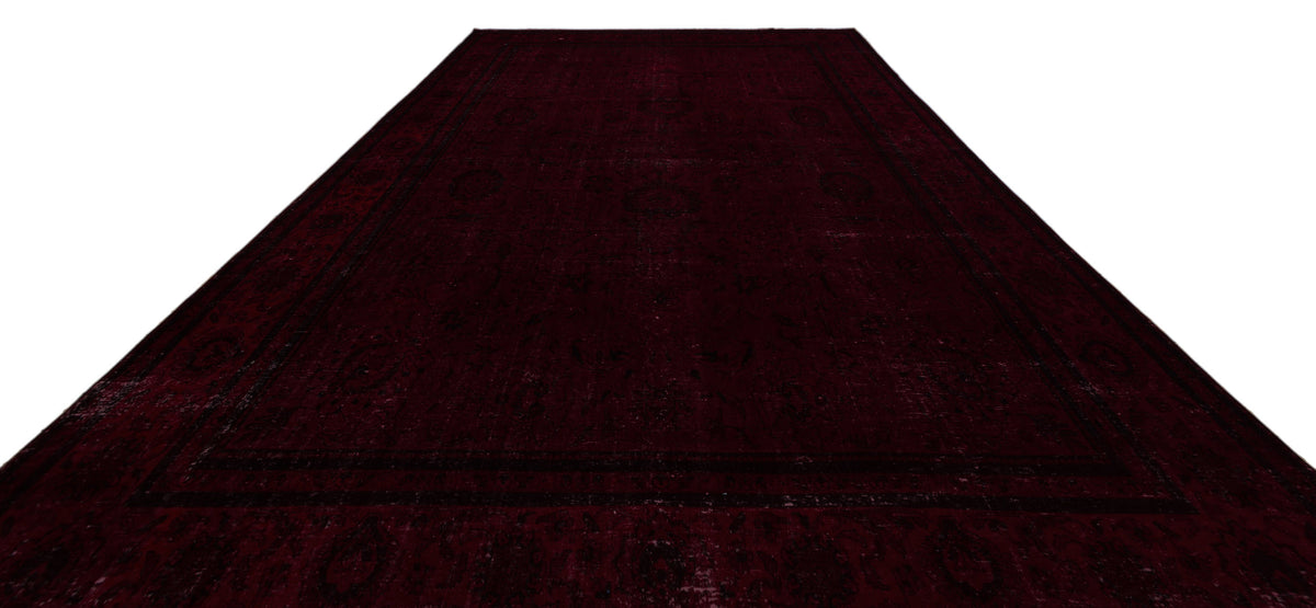 Deep burgundy traditional rug with a subtle, dark-toned ornate medallion pattern and a wide border.