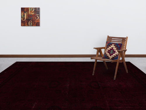Load image 1 in gallery view. Deep burgundy traditional rug with a subtle tonal pattern, styled in a room with a wooden chair and wall clock.