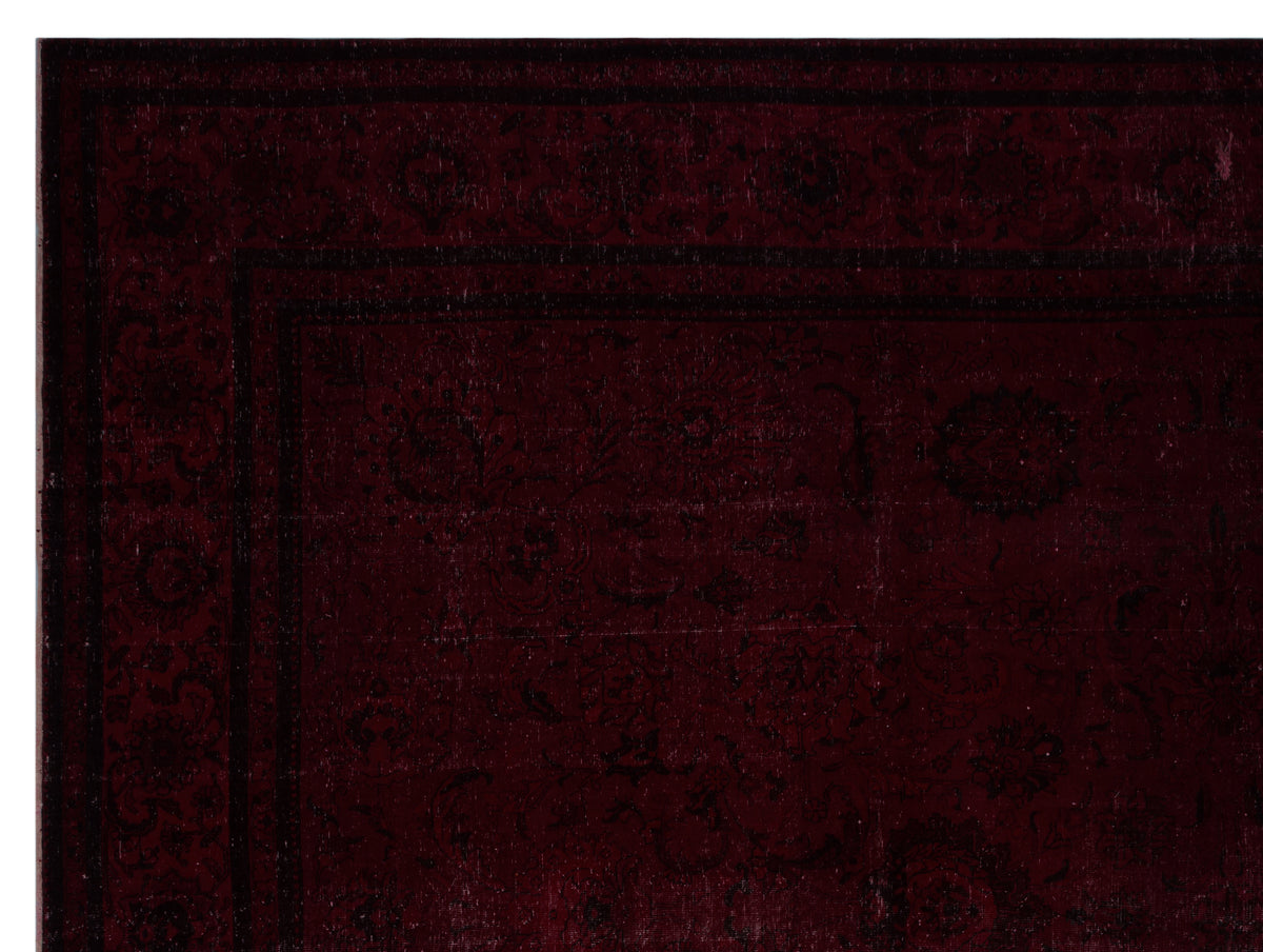 Deep burgundy rug with a dark, tonal traditional floral pattern and a wide decorative border.