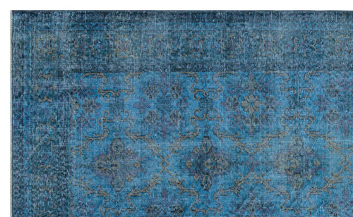 Load image 1 in gallery view. Distressed blue rug with a faded traditional floral medallion pattern and a dark border.