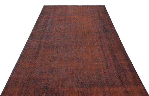 Load image 1 in gallery view. Distressed rust-red and charcoal vintage-style rug with a faint, faded traditional pattern on a white background.