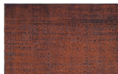 Load image 1 in gallery view. Rust-colored rug with a dark, distressed traditional floral pattern and visible horizontal weave texture.