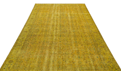 Load image 1 in gallery view. Mustard yellow vintage-style rug with a faded, intricate floral medallion pattern and a decorative border.