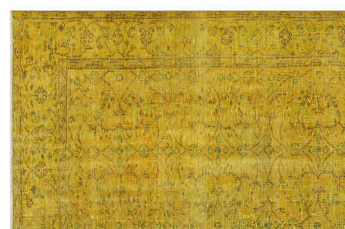 Load image 1 in gallery view. Mustard yellow vintage-style rug with a distressed floral medallion pattern and a detailed border.