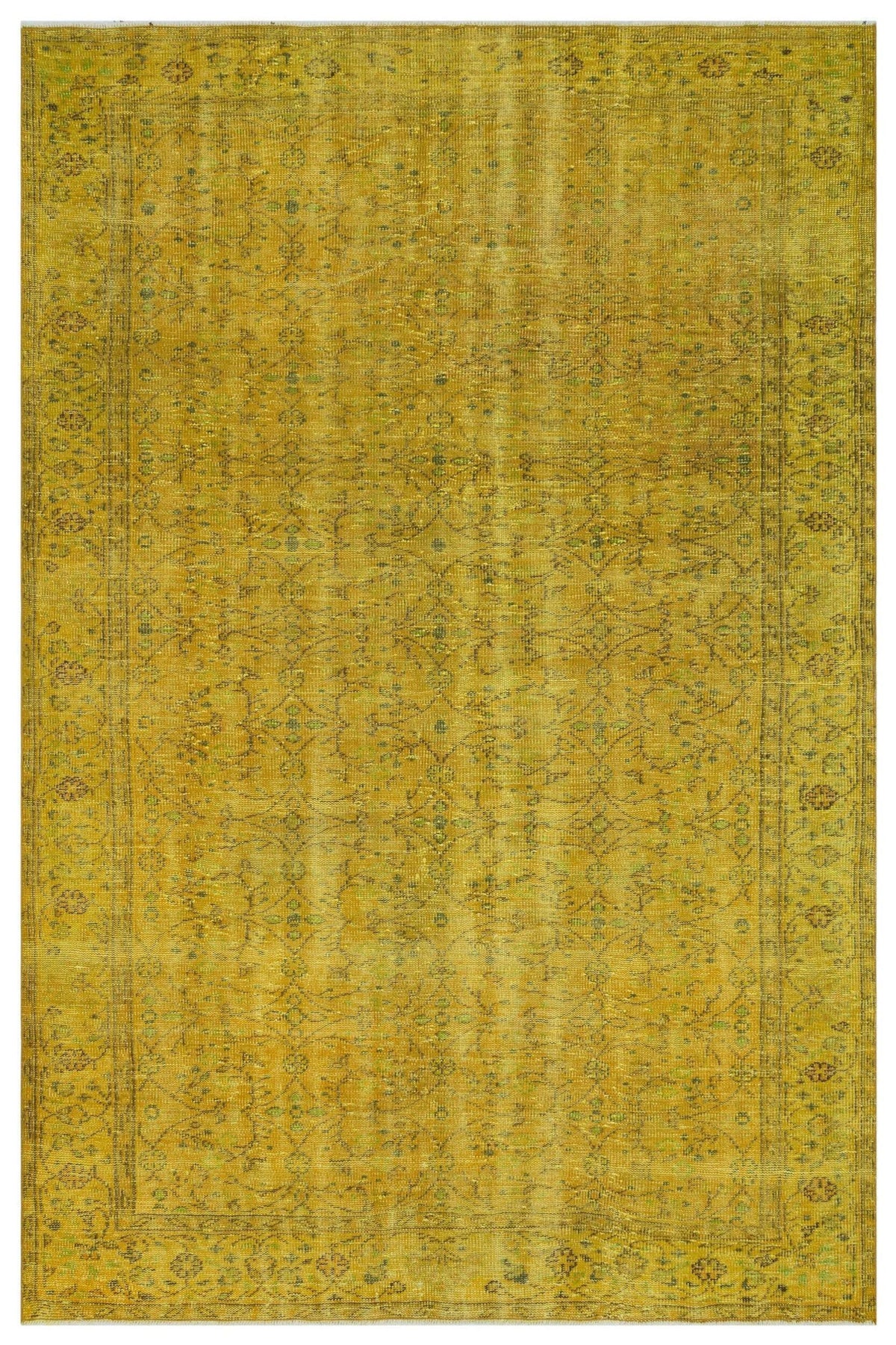 Mustard yellow vintage-style rug with a faint, distressed floral pattern and a decorative border.