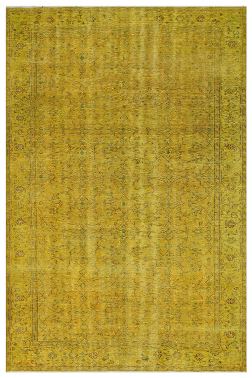 Load image 1 in gallery view. Mustard yellow vintage-style rug with a faint, distressed floral pattern and a decorative border.
