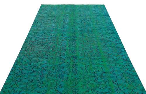 Load image 1 in gallery view. Emerald green vintage-style rug with a distressed black floral medallion pattern on a white background.