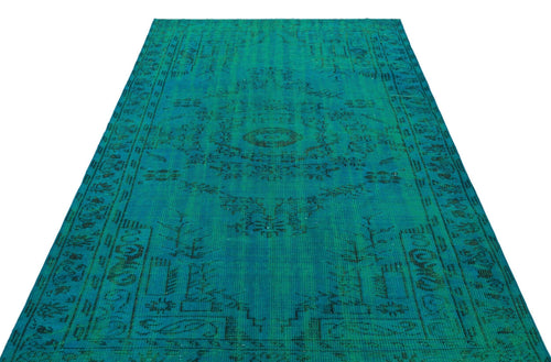 Load image 1 in gallery view. Teal and black distressed vintage-style rug with a central medallion and ornate border pattern on a white background.