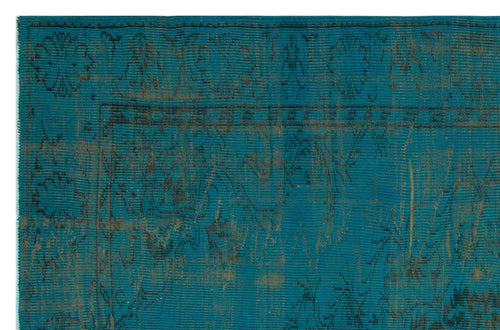Load image 1 in gallery view. Teal and dark brown distressed rug with a traditional floral medallion border and intricate vine pattern.