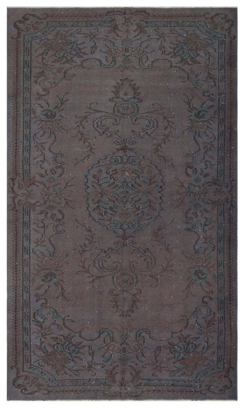 Load image 1 in gallery view. Dark brown and teal traditional rug with a central floral medallion and ornate border pattern.