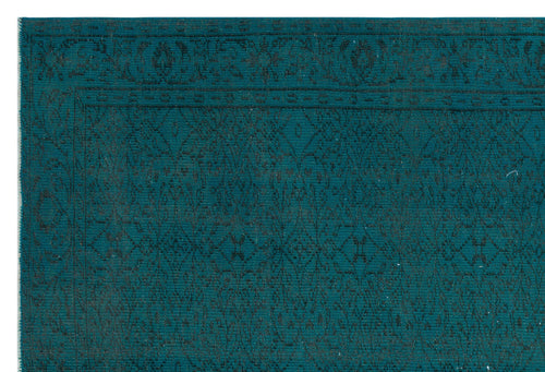 Load image 1 in gallery view. Teal rug with a dark, intricate geometric diamond pattern and a decorative border.