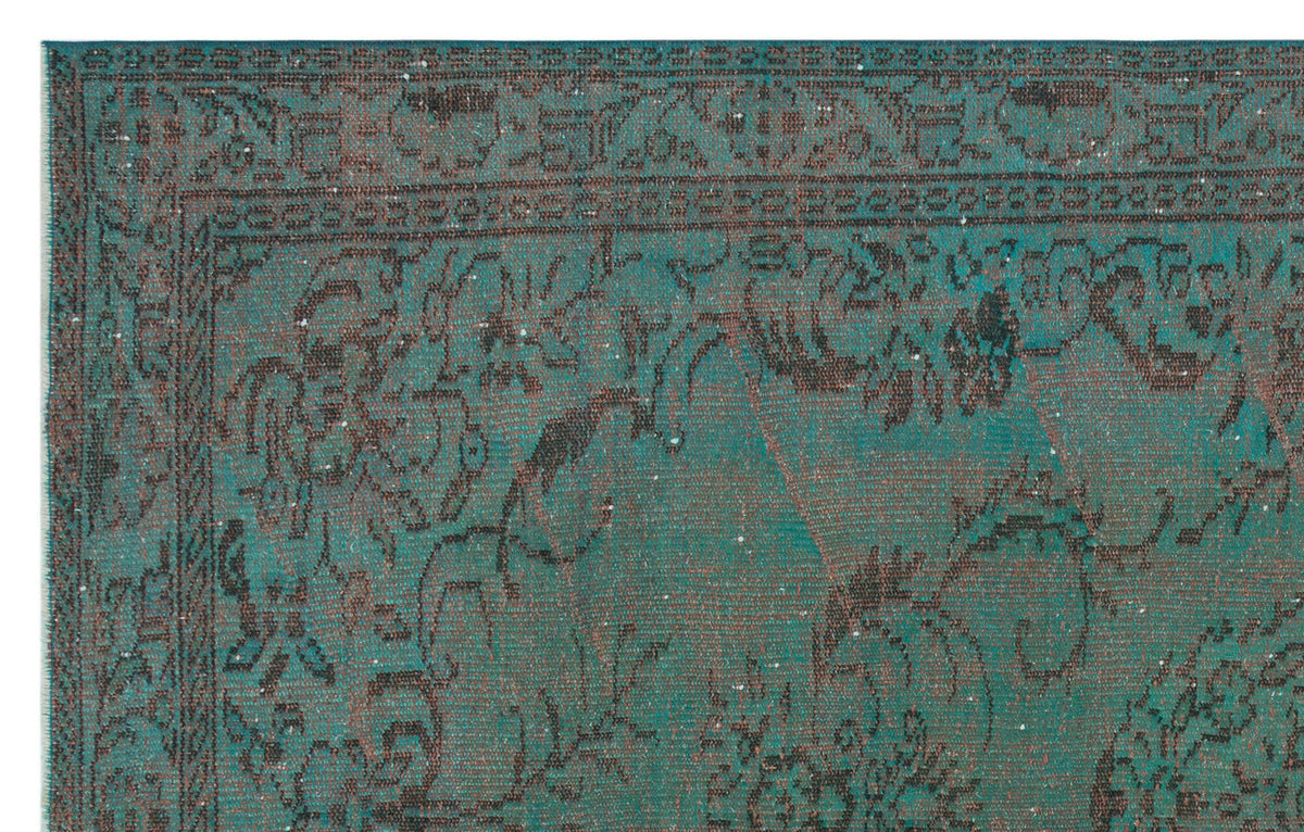 Teal and charcoal distressed traditional rug with an ornate floral border and central medallion pattern.