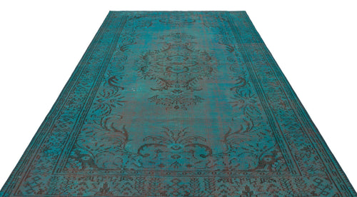 Load image 1 in gallery view. Teal and dark brown distressed rug with a traditional central medallion and ornate border pattern on a white background.