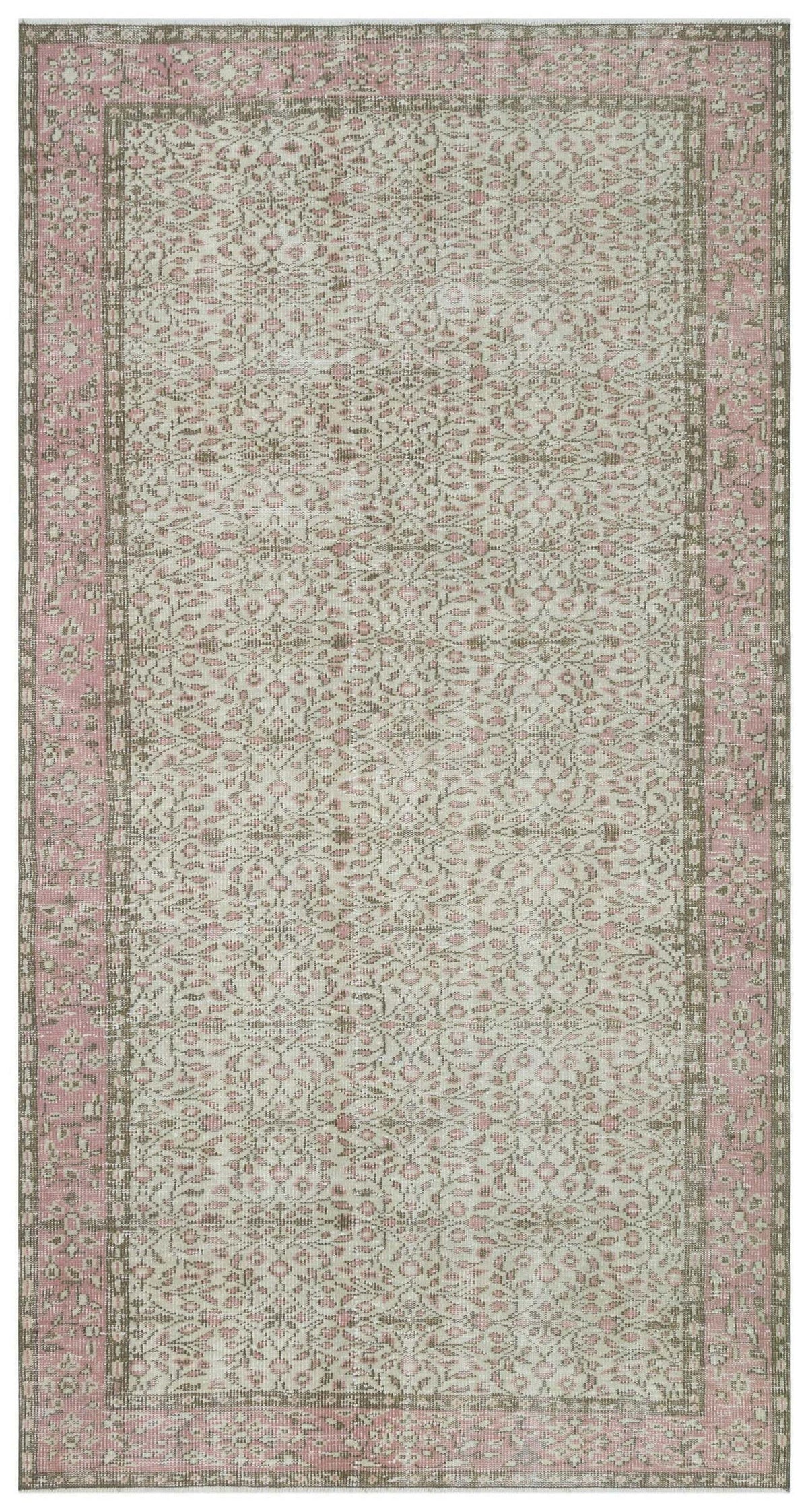 Distressed beige and pink rug with a traditional floral medallion pattern and a wide decorative border.