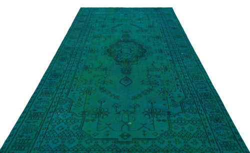Load image 1 in gallery view. Emerald green runner rug with a dark, distressed traditional medallion pattern and geometric border.