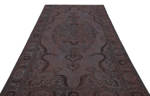 Load image 1 in gallery view. Dark brown traditional rug with a central medallion and ornate border pattern on a white background.